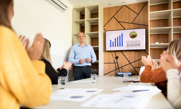 istock Businessman getting an applause after the successful presentation 1335255844