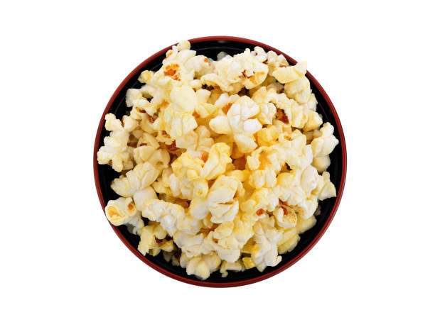 istock Popcorn in black bowl isolated on white 1335255846