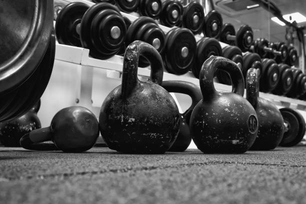 istock bar and kettlebell weights on rubber floor ready for strength and conditioning workout. 1335257249