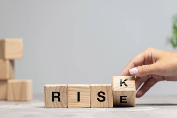 istock Wooden cubes, blocks with word RISK in female hand. Conceptual image about human rights, education, social issues, mental health, education and personal development. 1335257520