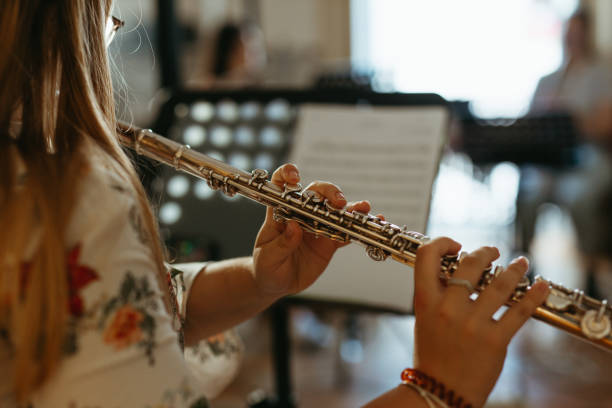 istock Low Angle View Of Woman Playing Piano 1335257639