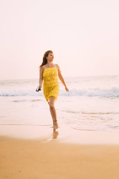 istock Full Length Of Boy On Beach Against Sky 1335257738