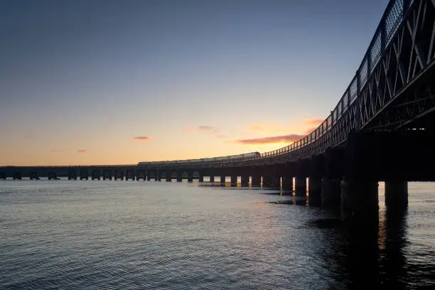 DUNDEE SCOTLAND - JANUARY 2 2021: The Tay Bridge carries the railway across the Firth of Tay in Scotland between Dundee and the suburb of Wormit in Fife.