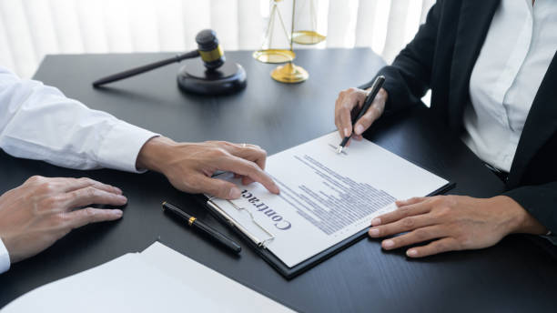 istock Midsection Of Lawyer Talking With Client 1335260644