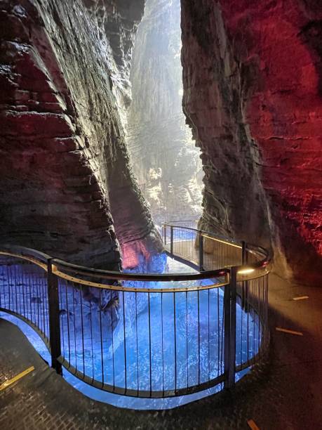 istock waterfall in cave with colored lights cascate del varone 1335261423