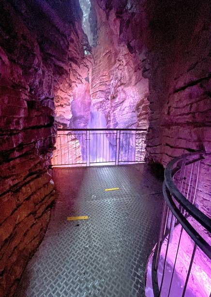 istock waterfall in cave with colored lights cascate del varone 1335261427