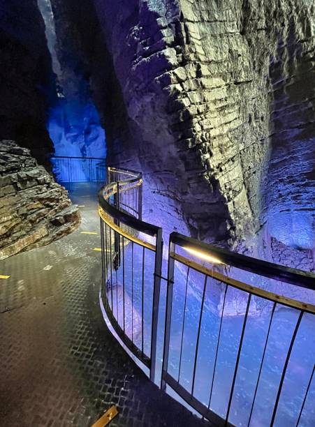 istock waterfall in cave with colored lights cascate del varone 1335261428