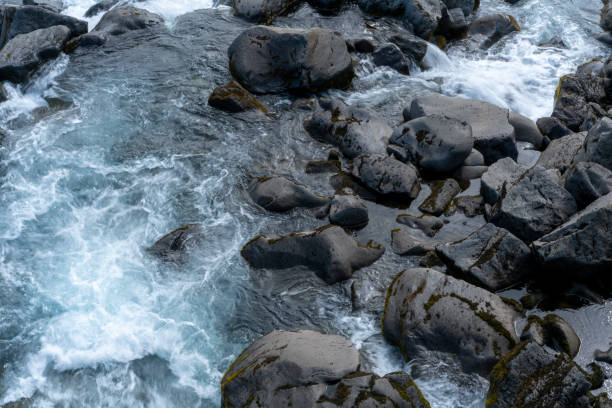 Rapids at Oxararfoss waterfall in Thingvellir National Park, Iceland a UNESCO World Heritage Site. The Oxarar river runs through Mid-Atlantic Ridge, a boundary between two tectonic plates, the Eurasian and the North Americans  which is product of earth movements.