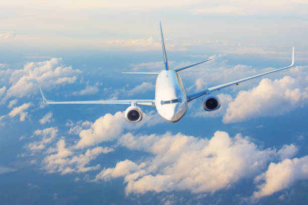 istock Airplane high in the sky at sunset. 1335266959