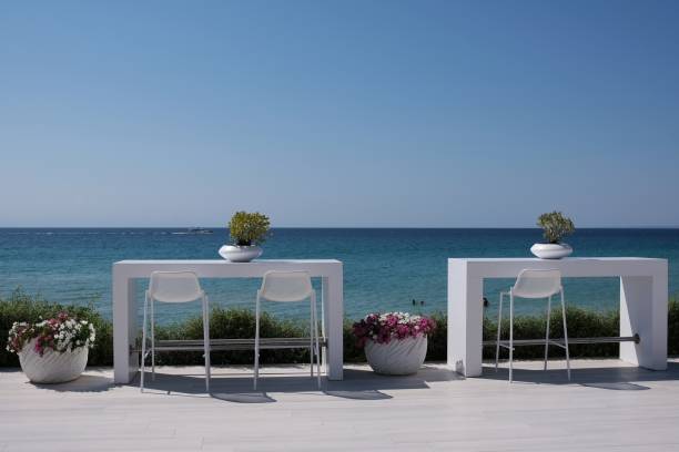 Amazing view Beautiful decorated outdoor tables and chairs overlooking the aegean ocean in Halkidiki Greece halkidiki beach stock pictures, royalty-free photos & images