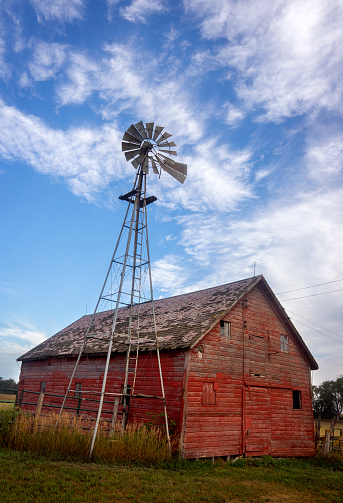 An old barn and windmill on a South Dakota farm.