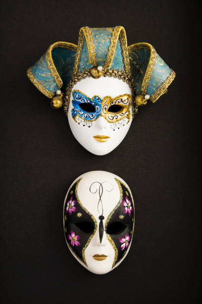 istock Two venetian carnival masks on the black background. Close-up. 1335269216