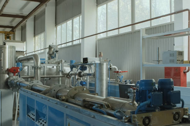 istock Stainless steel pipe in shop. pumps on the pipe. 1335272333