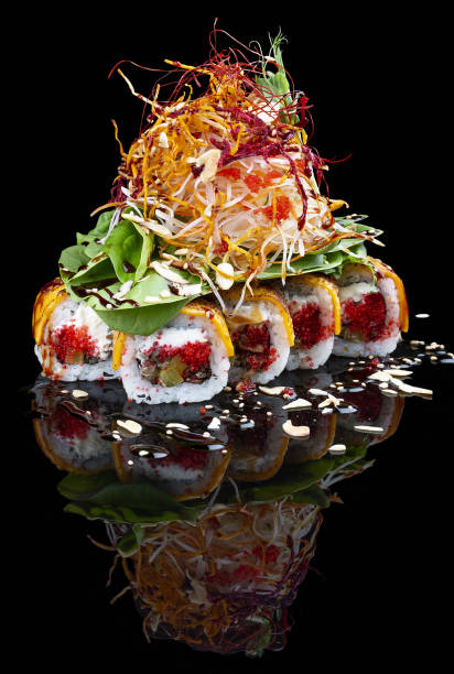 istock Philadelphia roll with eel and lettuce on glossy black background 1335273681