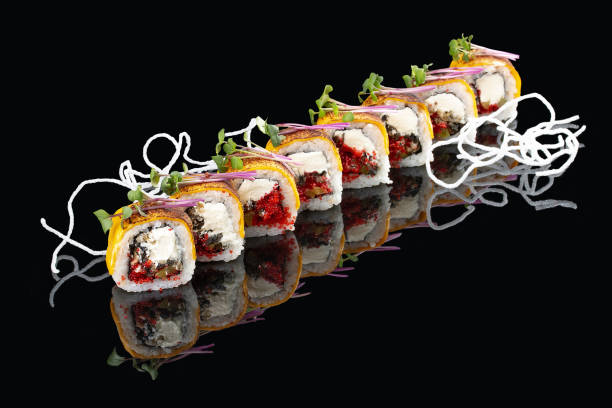 istock Fresh roll with salmon belly and melted cheese on glossy black background 1335274282