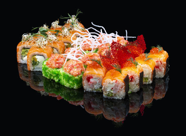 istock A set of assorted large sushi rolls on a glossy black background 1335274293