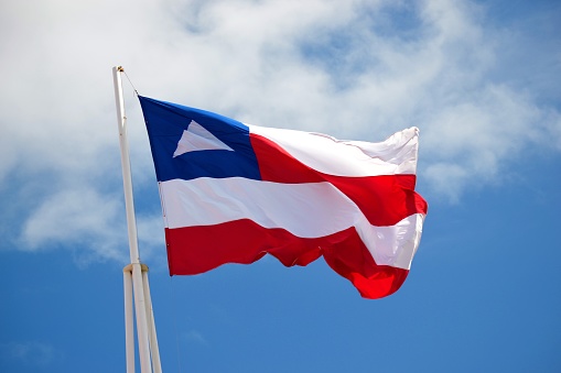 Puerto Rican Flag on cracked wall background.