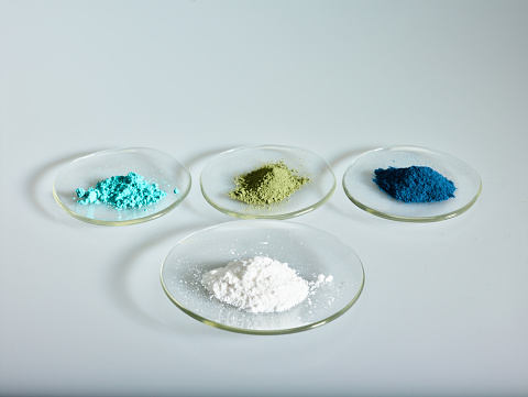 Colorful dry chemicals and magnetic material in loose powder form varying in a wide range of shades.