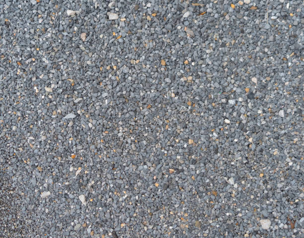 istock Granite gravel stone rocks flooring pattern surface texture. Close-up of exterior material for design decoration background. Rubble 1335282314