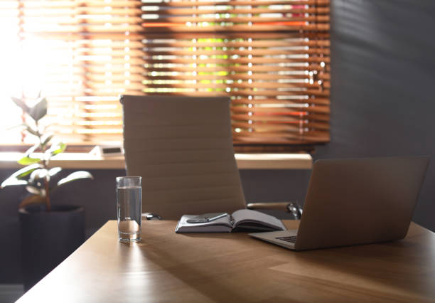 istock Laptop on wooden table in modern office 1335282702