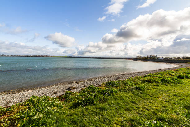 istock View over water to land on the other side. 1335283656