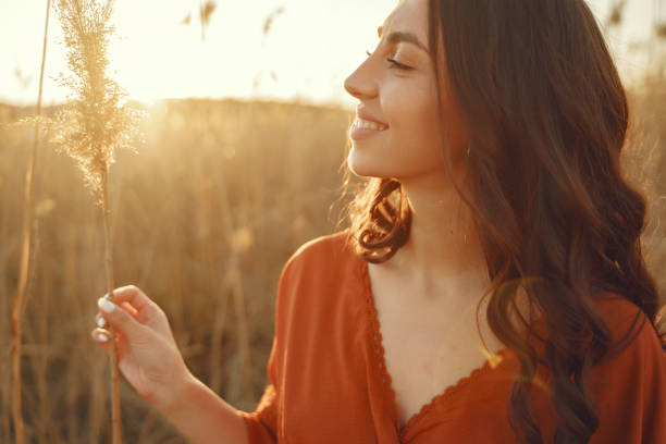istock Stylish woman spending time in a summer field 1335284512