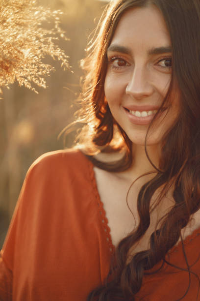 istock Stylish woman spending time in a summer field 1335284519