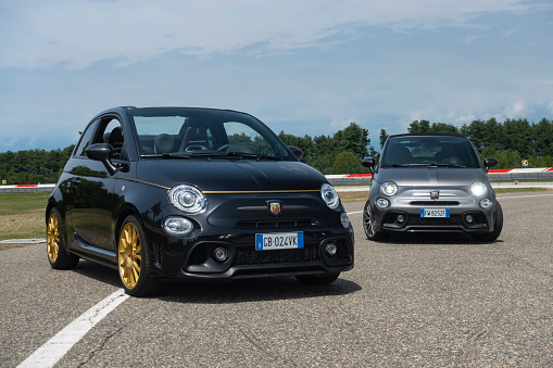 Balocco, Italy - 12 June, 2021: Abarth 595/500 vehicles parked on a road. This model is one of the fastest A-segment cars on a market.