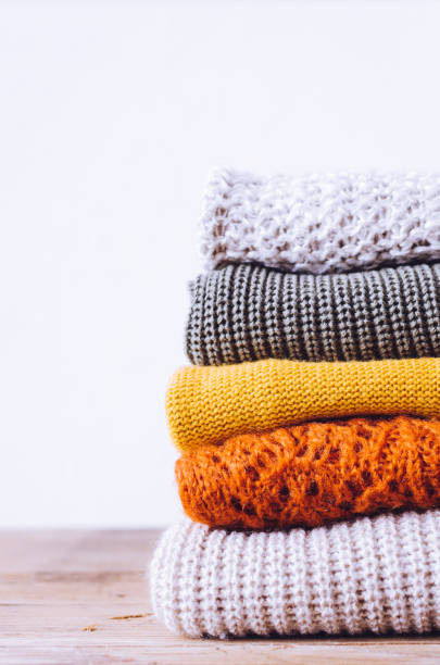 istock Pile of knitted woolen sweaters 1335286358