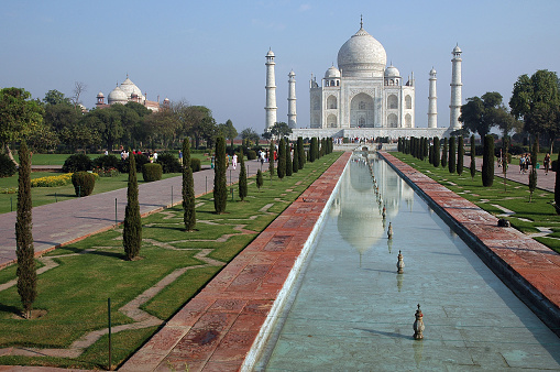 Uttar Pradesh, India - march 07, 2006: Pond and gardens with the Taj Mahal building in the background