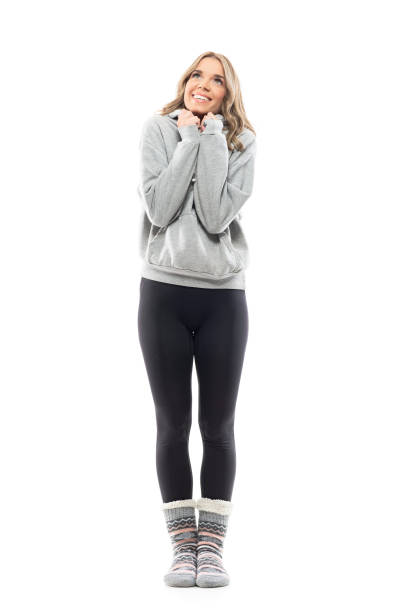 istock Excited cute cheerful young woman in sweatshirt squeezing enthusiastic. 1335288828