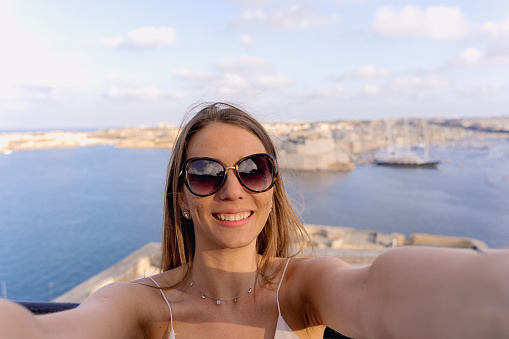 woman taking a selfie in La Valletta, Malta