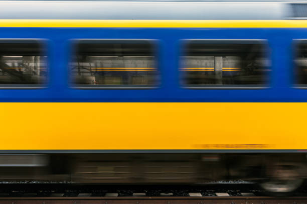 train is passing by with high speed - trein nederland stockfoto's en -beelden