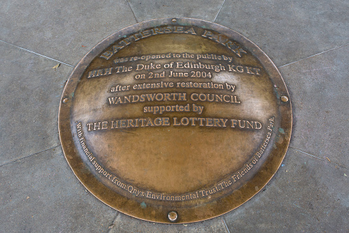 Battersea, London, UK - August 20th 2021. Plaque commemorating the opening of the park in the bandstand at Battersea Park.