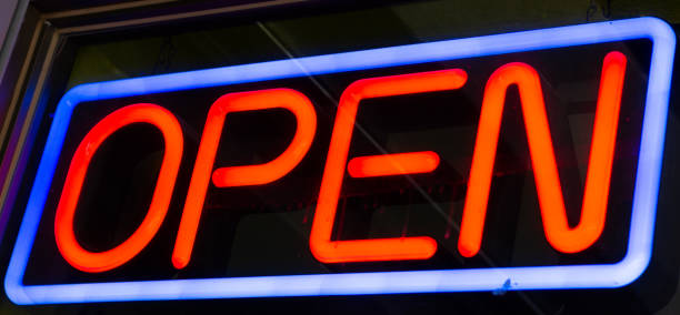 istock Blue and red neon open sign at night 1335295081
