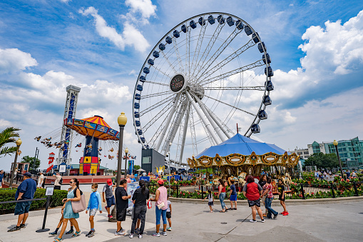 Chicago, Illinois, USA - August, 13, 2021: Navy Pier Park attractions on blue sky background during summer season.