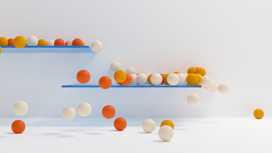 Colorful balls falling from shelves