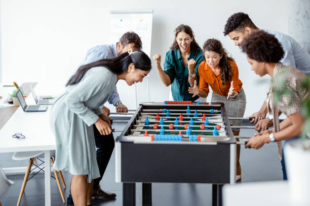 istock Office People Enjoying Table Soccer 1335296671