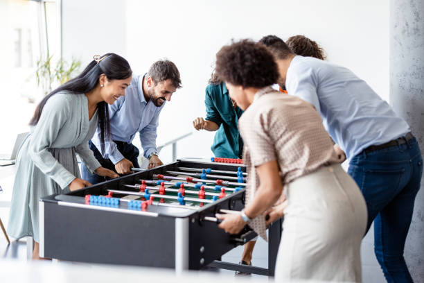 istock Office People Enjoying Table Soccer 1335296674