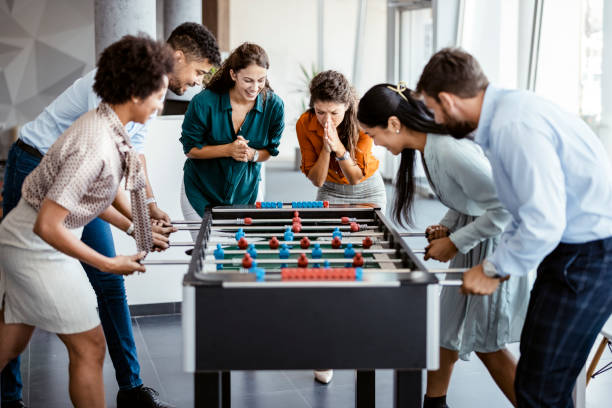 istock Office People Enjoying Table Soccer 1335296691
