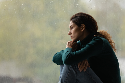 Side View Frustrated Thoughtful Woman Looking Out Rainy Window Stock Photo - Download Image Now - iStock