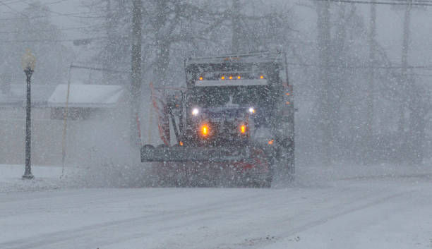 istock Snow plow working in zero visibility clearing the roads during a blizzard 1335299434