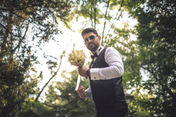 istock Groom holding a bridal bouquet 1335301576