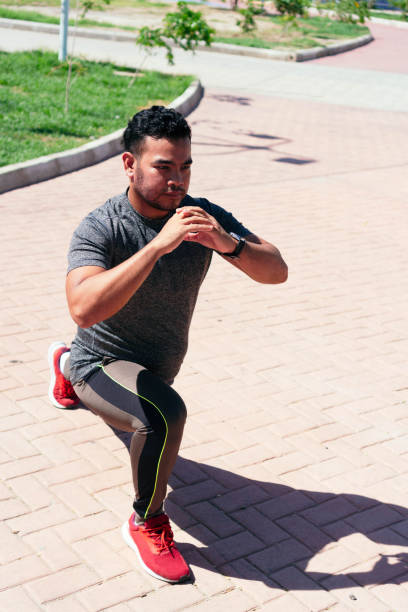 istock man warming up before his race in the city. 1335304123