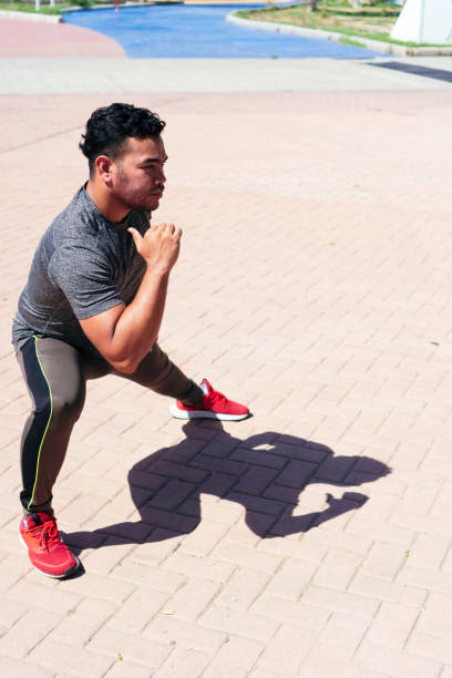 istock man warming up before his race in the city. 1335304154