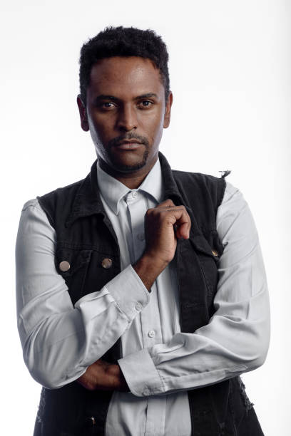 istock Attractive adult man looking at camera during studio portrait. 1335305052