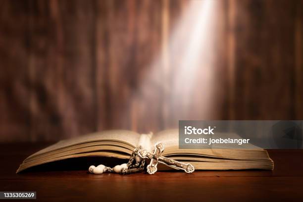 Rosery Across A Bible Stock Photo - Download Image Now - Bible, Rosary Beads, Illuminated