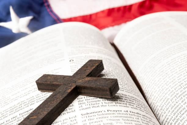 istock Small wooden cross on Bible 1335305348
