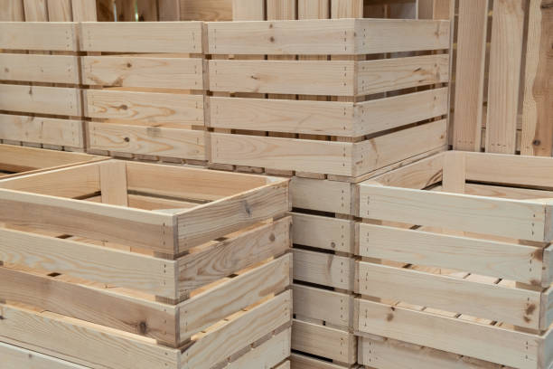 istock Empty Wooden Boxes Containers Crates for harvest. Stacked storage boxes from wood on row. Background 1335310344