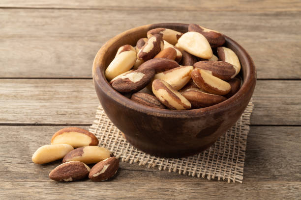 istock Brazil nuts in a bowl over wooden table 1335312025